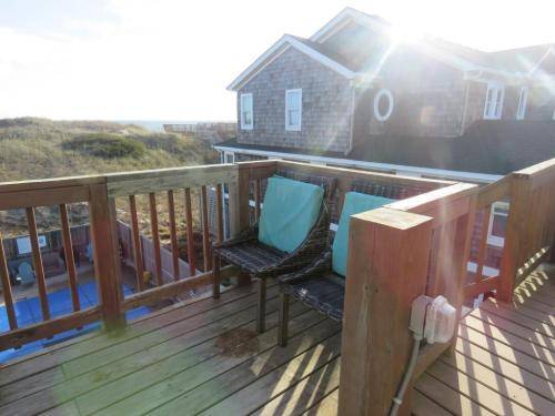 Sit on the back top deck and listen to the waves crashing on the beach 