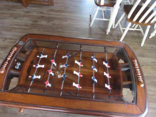 The coffee table is also a Foosball table 