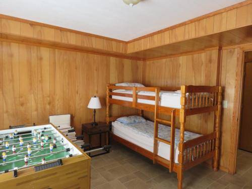 Bottom floor game room also has a bunk bed 